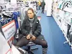Cute milf pisses in the middle of a store